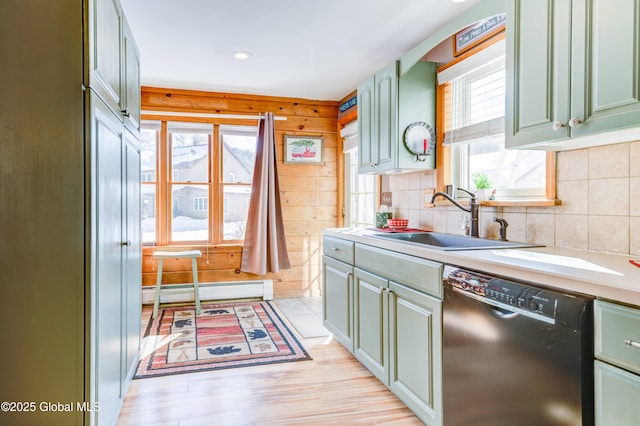 kitchen featuring a baseboard radiator, black dishwasher, sink, decorative backsplash, and light wood-type flooring