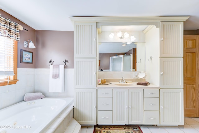 bathroom with vanity, tile patterned floors, and shower with separate bathtub