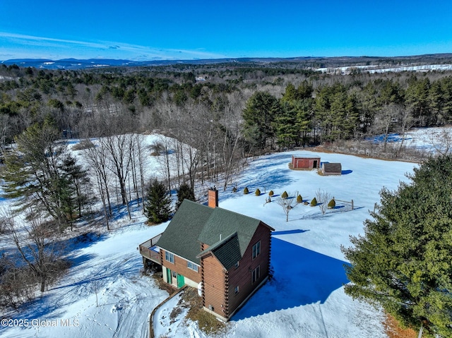 snowy aerial view with a mountain view