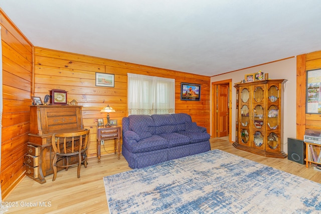 living room featuring hardwood / wood-style flooring and wood walls