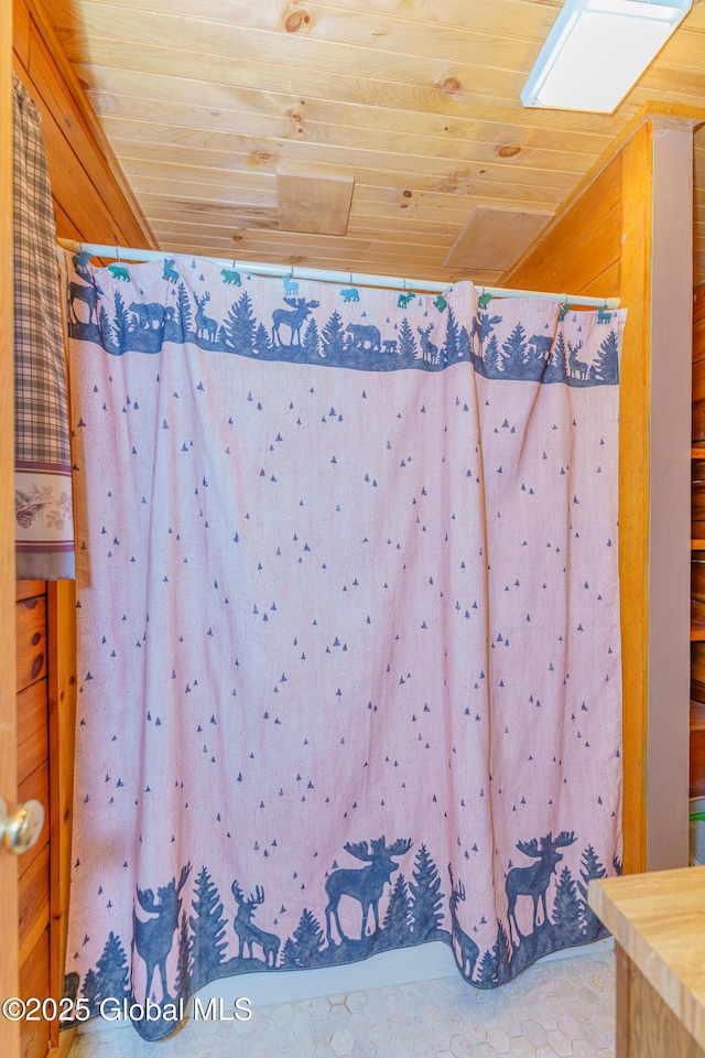 bathroom with wood ceiling