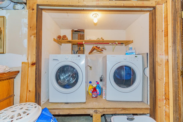 laundry area with independent washer and dryer