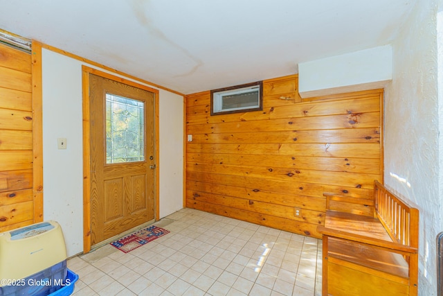 entrance foyer featuring wooden walls