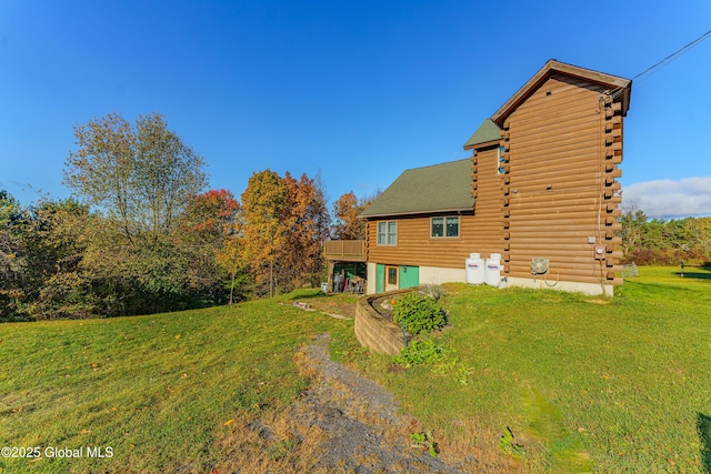 exterior space featuring a deck and a lawn