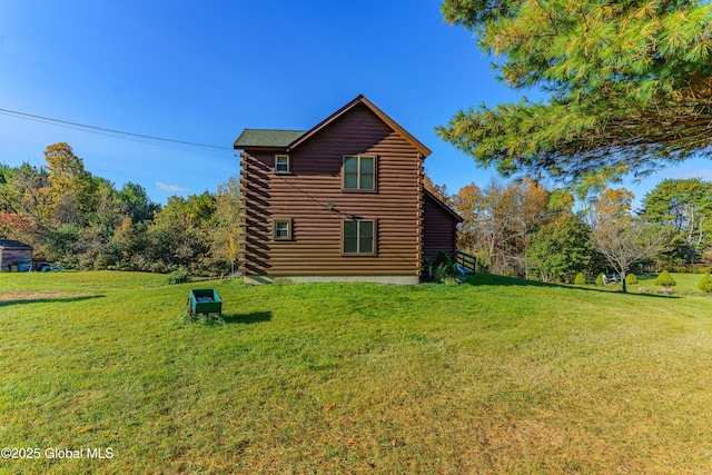 back of house with a yard