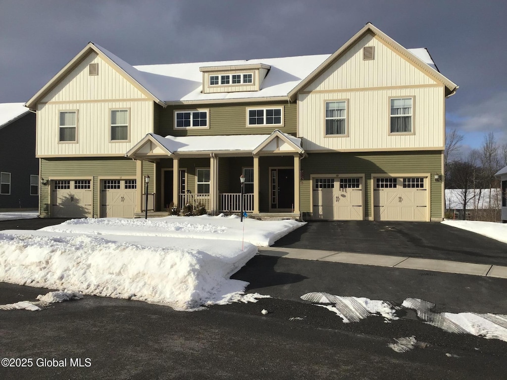 view of front of home with a garage and a porch