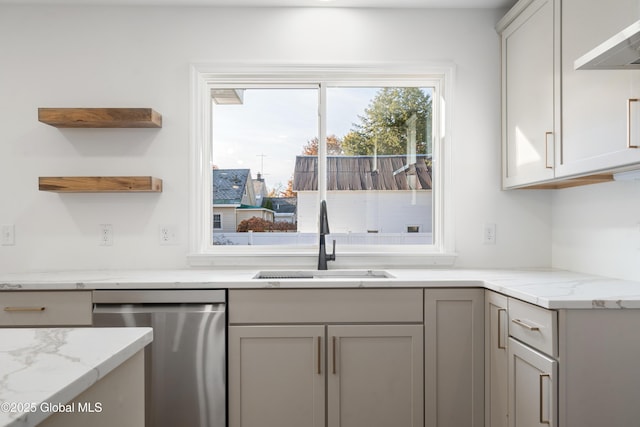 kitchen featuring sink, gray cabinets, dishwasher, light stone countertops, and wall chimney exhaust hood