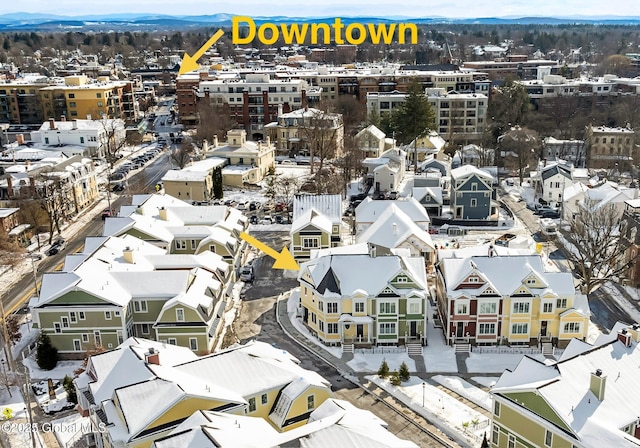 drone / aerial view featuring a residential view and a mountain view