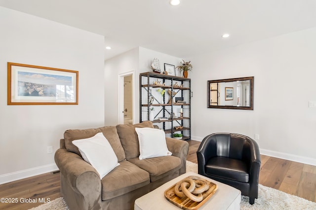 living area with recessed lighting, dark wood finished floors, and baseboards