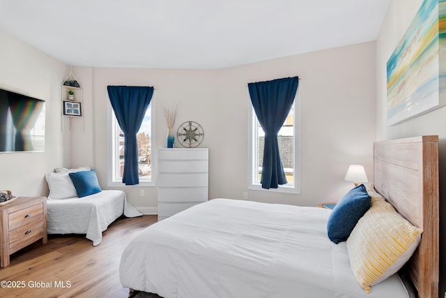 bedroom with light wood finished floors