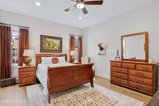 bedroom featuring light wood-type flooring, baseboards, a ceiling fan, and recessed lighting