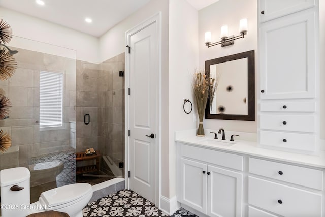 full bathroom with vanity, a shower stall, toilet, and recessed lighting