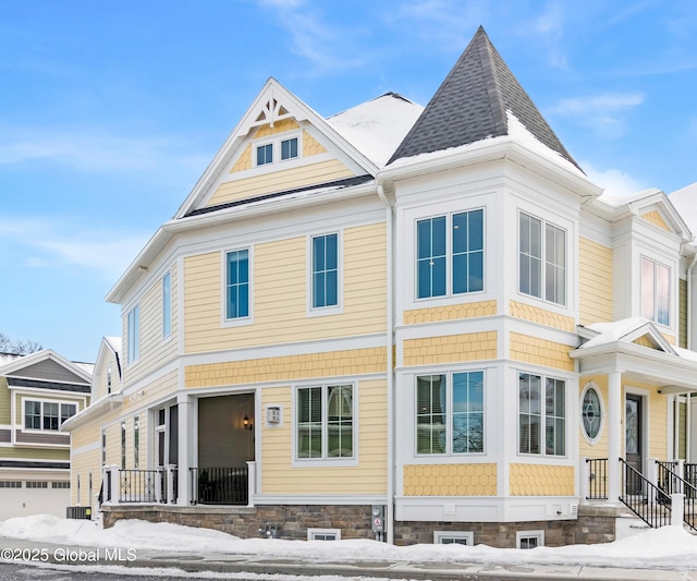 view of front of home featuring a shingled roof