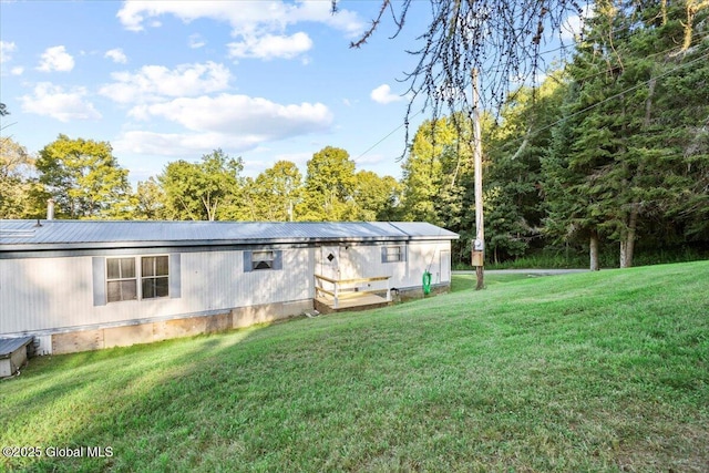 rear view of house with a lawn