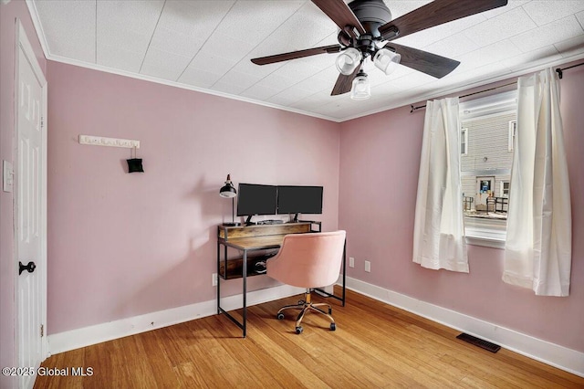 office area featuring crown molding, ceiling fan, and wood-type flooring