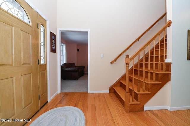 foyer entrance with light wood-type flooring