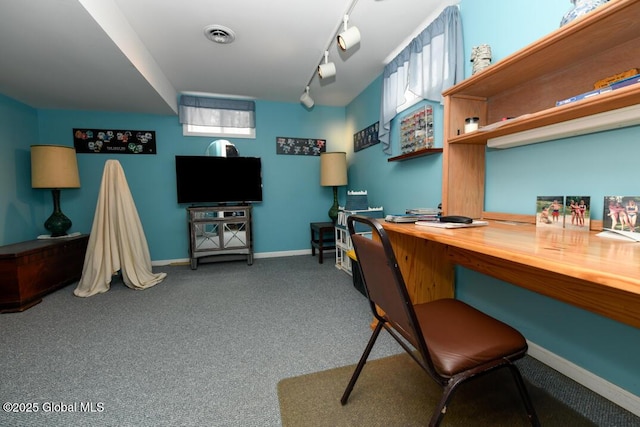 carpeted office space featuring rail lighting