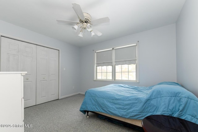 bedroom with ceiling fan, a closet, and light carpet