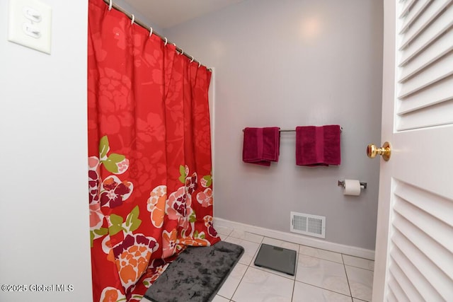 bathroom with tile patterned flooring