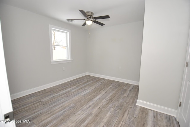 unfurnished room with ceiling fan and light hardwood / wood-style floors