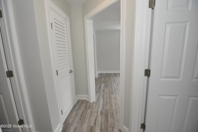 hall with light hardwood / wood-style flooring