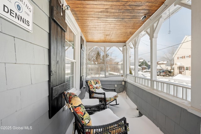 sunroom featuring wood ceiling