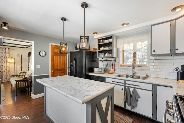 kitchen featuring open shelves, a sink, white cabinets, a center island, and black appliances