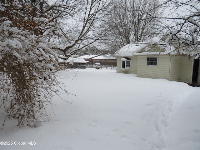 view of yard covered in snow