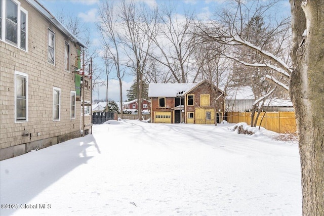 view of yard layered in snow