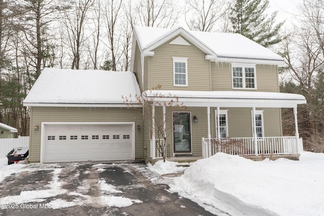 view of front facade featuring a garage and covered porch