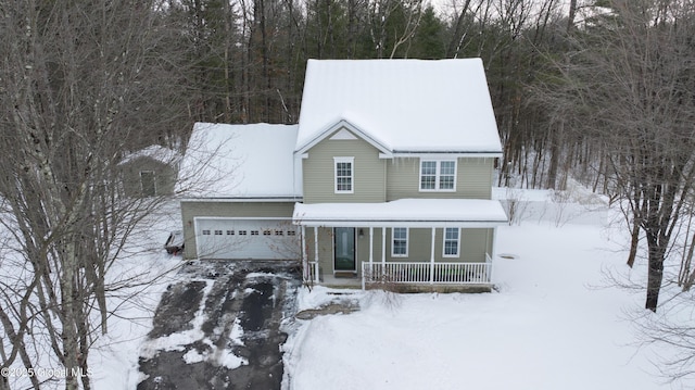 view of front of home with a garage and covered porch