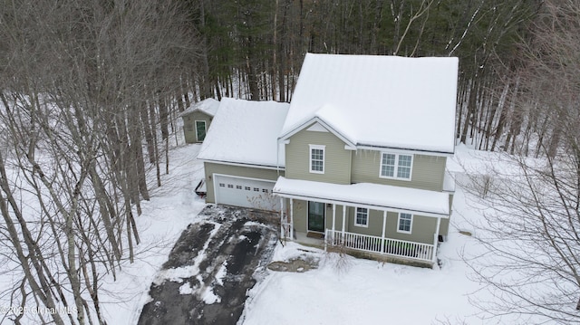 view of front of property featuring a porch and a garage