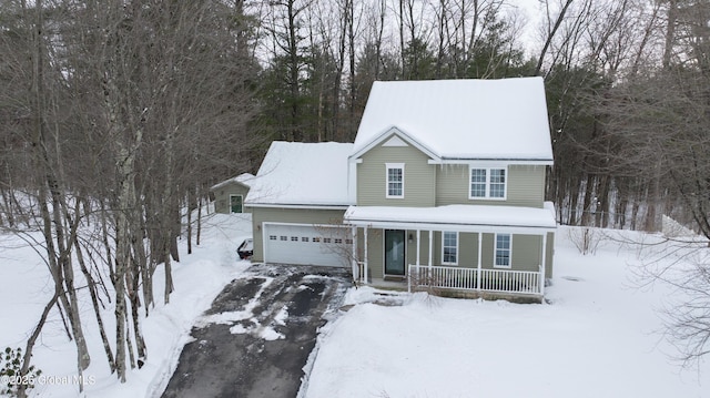 view of front facade with a garage and a porch