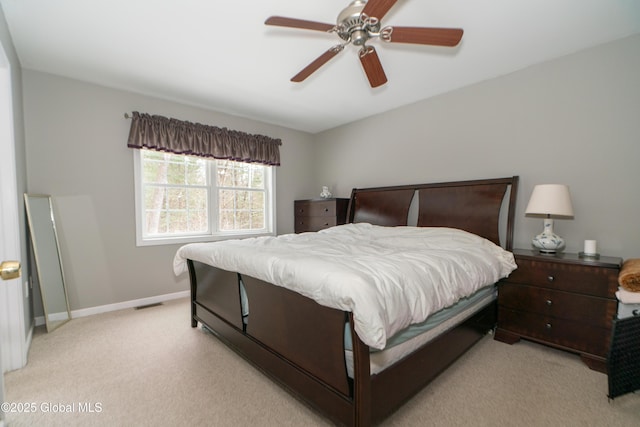 bedroom featuring ceiling fan and light carpet