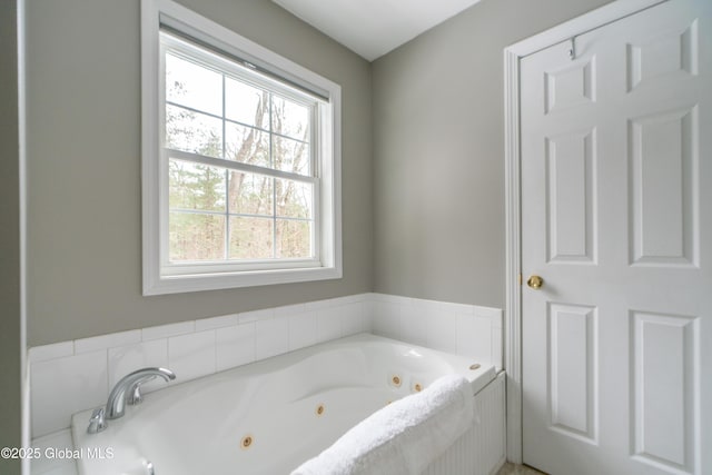 bathroom with tiled tub