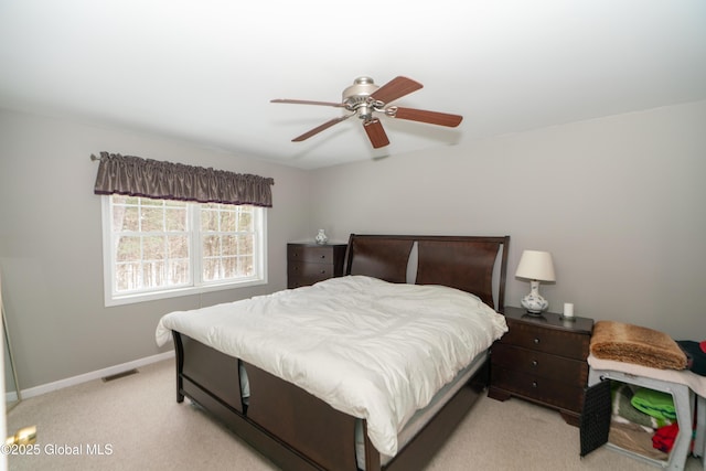 bedroom featuring light colored carpet and ceiling fan