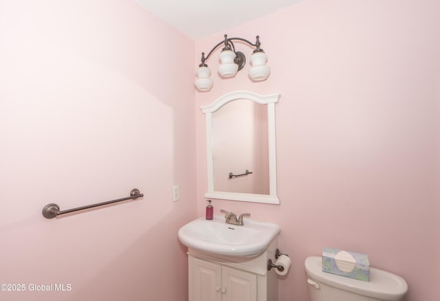 bathroom featuring vanity and toilet