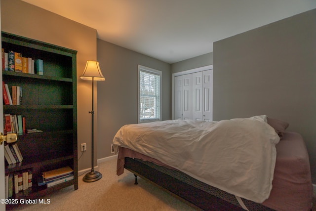 carpeted bedroom featuring a closet