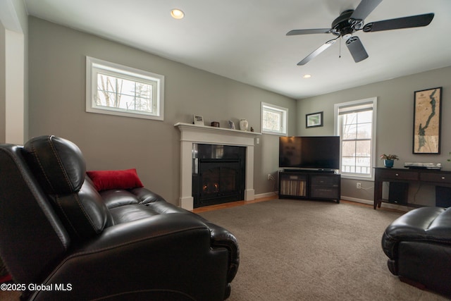 living room with light colored carpet and ceiling fan