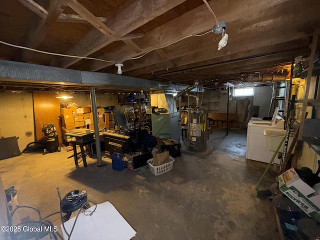 basement with washer / clothes dryer and gas water heater