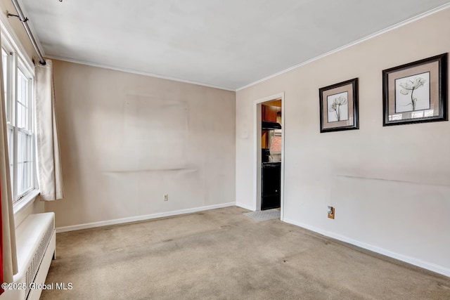 carpeted spare room featuring ornamental molding and a wall mounted air conditioner