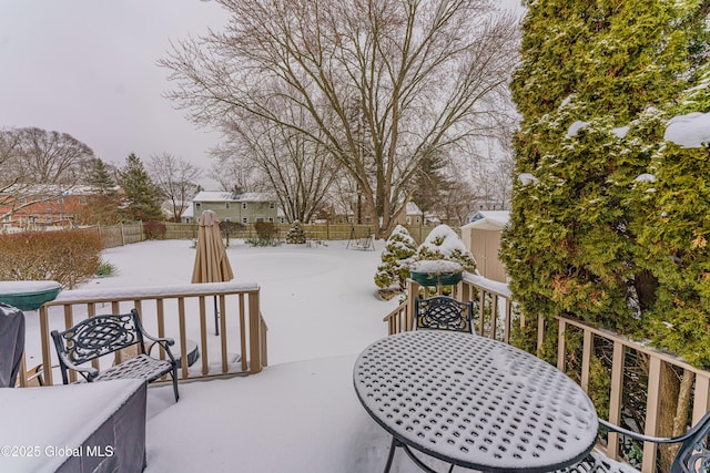 view of snow covered deck