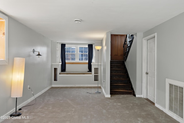 stairs featuring visible vents and baseboards