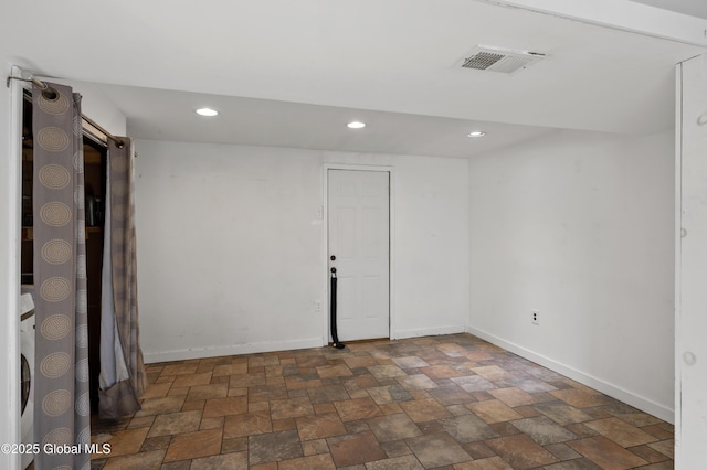 spare room featuring recessed lighting, visible vents, baseboards, and stone finish floor