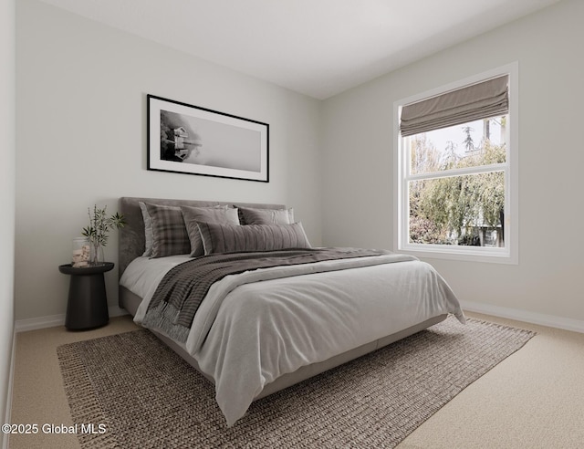 bedroom featuring carpet and baseboards