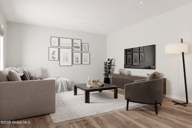 living room featuring light wood-type flooring and recessed lighting