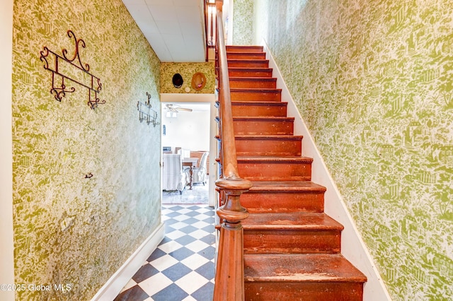 stairs with wallpapered walls and tile patterned floors