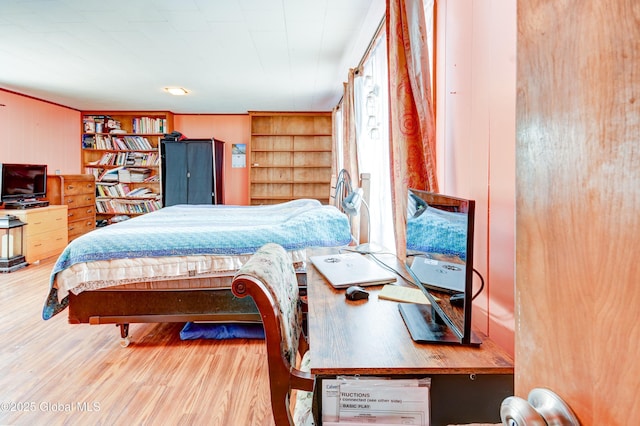 bedroom with wood finished floors