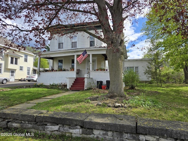 110 Montgomery St, Canajoharie, NY 13317 - view of front of property featuring a porch, a front lawn, and stairs