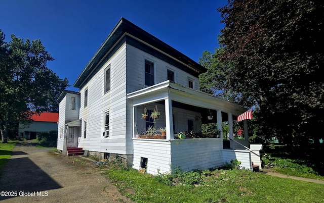 110 Montgomery St, Canajoharie, NY 13317 - view of property exterior featuring covered porch